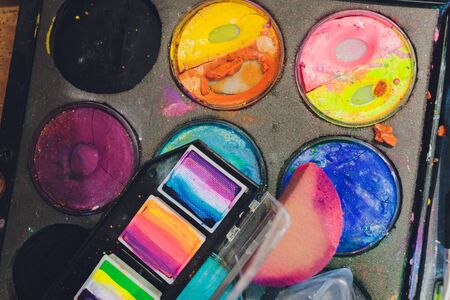 Face painting colors and tools of face painting artist. Concept photo artwork, art and craft