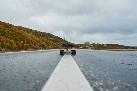 a skateboard on the road beautiful viewの写真素材