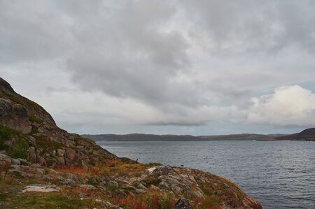 calm water of lake, woods on other side and blue sky. landscapeの写真素材