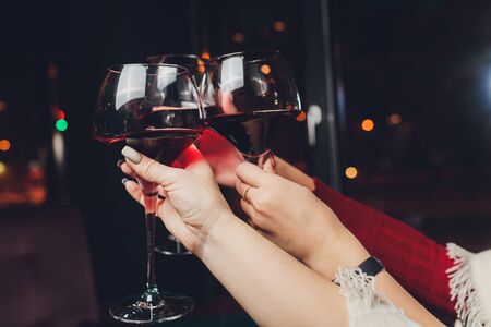 Clinking glasses with alcohol and toasting, partyの写真素材