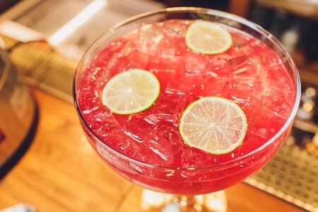 bartender prepares a great cocktail close-up on the background of the barの写真素材