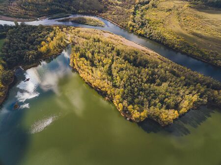 Aerial view of blue lakes and green forests on a sunny summer day
