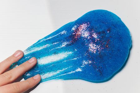 Kid Playing Hand Made Toy Called Slime Alien drool Shell mussel