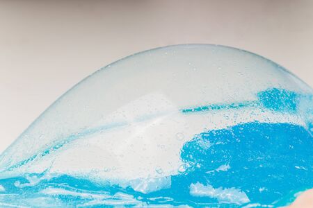 Kid Playing Hand Made Toy Called Slime Alien drool Shell mussel.の写真素材