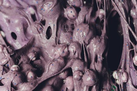 Kid Playing Hand Made Toy Called Slime Alien drool Shell mussel.の写真素材