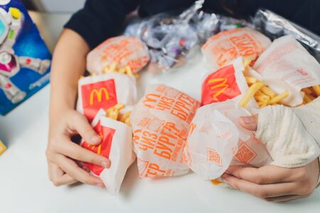 Ufa, Russia, 1 July, 2019: an expanded cheeseburger from McDonalds from a set of Happy Mill. Toy.のeditorial素材