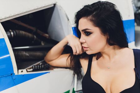 female helicopter maintenance worker Engineer maintaining a heavy.の写真素材