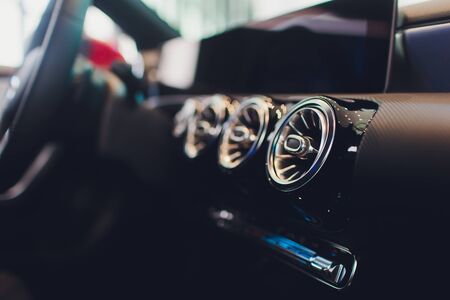 car interior. Modern car speedometer and illuminated dashboard. Luxurious car instrument cluster....