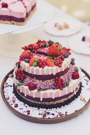 White Cream Icing Cake with Fruits and Chocolate