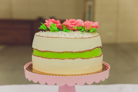 White Cream Icing Cake with Fruits and Chocolate