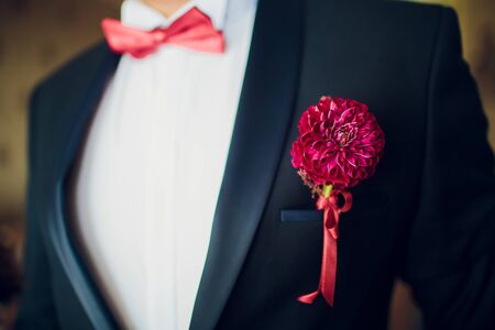 Beautiful boutonniere of the groom. Design a boutonniere. Wedding day.