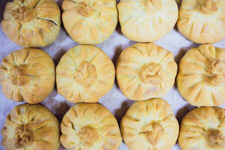 Preparation of belyashes. Traditional russian meat pies belyashi. belyashes on a table. Russian,...