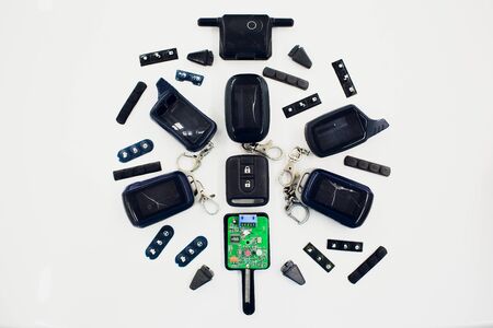 Close-up damaged car key isolated on white background.