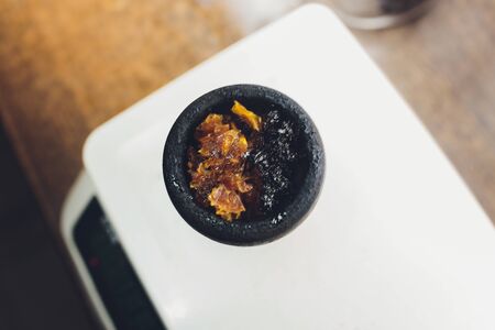 Clay bowl for hookah with tobacco kitchen scaleの写真素材