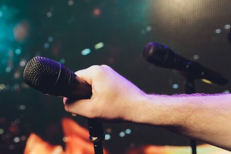 Close up of microphone on stage in audience room blur backgroundの写真素材