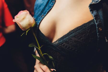 black short sweater with neckline female breast.の写真素材