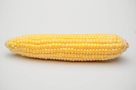 fresh corn vegetable with green leaves isolated on white background