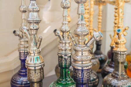 Group Of Modern Ceramic And Glass Hookah Or Shisha Appliance On The White Wooden Bar Counter, Sea View Restaurant.の写真素材