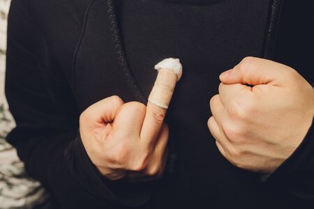 white medicine bandage on injury finger close-upの写真素材