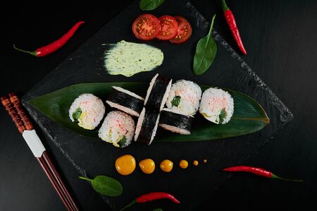 Traditional Japanese food - sushi, rolls and sauce on a black background. Top viewの写真素材