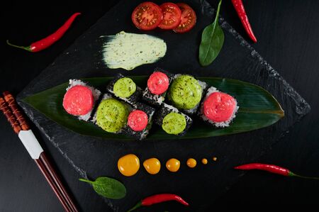 Traditional Japanese food - sushi, rolls and sauce on a black background. Top viewの写真素材