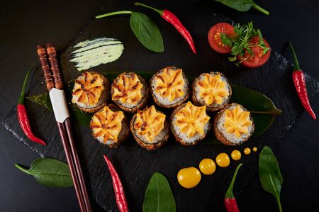 Traditional Japanese food - sushi, rolls and sauce on a black background. Top view.の写真素材