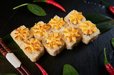 Traditional Japanese food - sushi, rolls and sauce on a black background. Top view.の写真素材