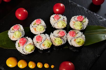 Traditional Japanese food - sushi, rolls and sauce on a black background. Top view.の写真素材