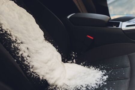 a man cleaning car interior by use foam chemical and scrubbing machine.の写真素材