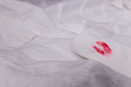white man clothes stain lipstick mistress close-upの写真素材