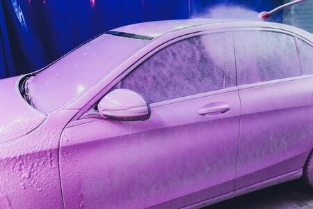 Close up cleaning car using high pressure water,High pressure jet washer in process of car washing...