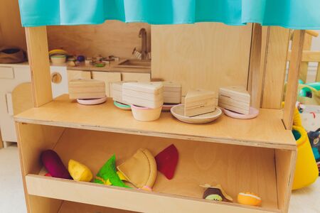 Set of BBQ Kitchen utensils. Childrens toys. Childrens kitchen game. Plastic bbq for playing with various colors in the room.の写真素材