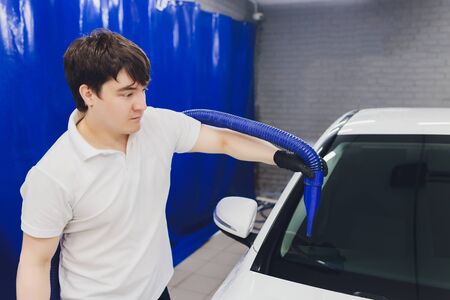 Car interior textile seats chemical cleaning with professionally extraction method. Early spring cleaning or regular clean up.の写真素材
