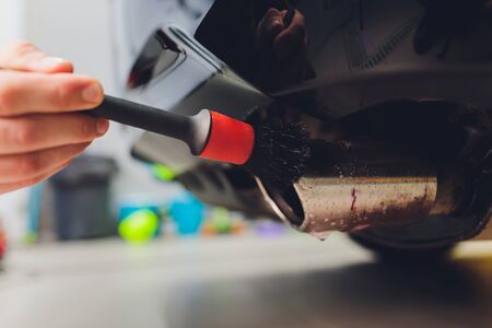 Car exhaust pipe with soap. Car wash background brushingの写真素材