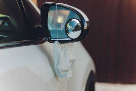 The medical mask in the car, virus concept.の写真素材