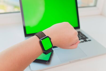 watch by use multiple internet electronic devices with green screen.の写真素材