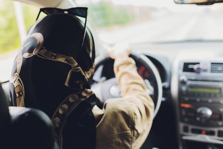Saudi Woman Driving a Car on the road. Muslim Woman Driver concept.の写真素材