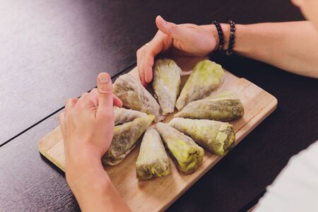cabbage stuffed with rice and meat on plate.の写真素材