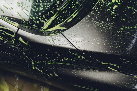 car in foam on carwash, car cleaning.の写真素材