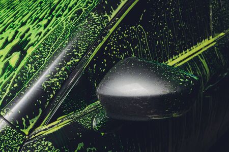 car in foam on carwash, car cleaning.の写真素材