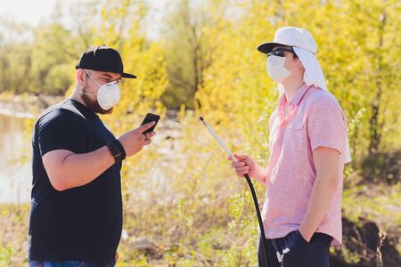 Man smoking shesha, hookah near the lake alone.