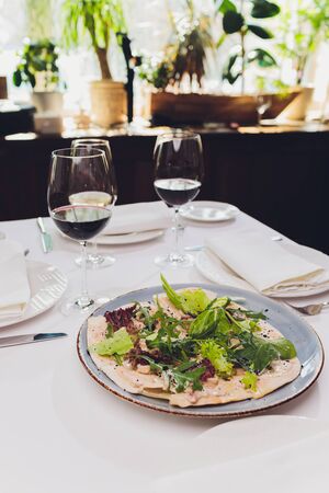 Nicoise Salad served in a restaurant in Cannes, France. Horizontal, tilted view.の写真素材