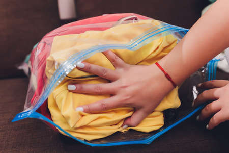 Space saver saving seal bag sucking air out , vacuum clothing storage compressed package.の写真素材