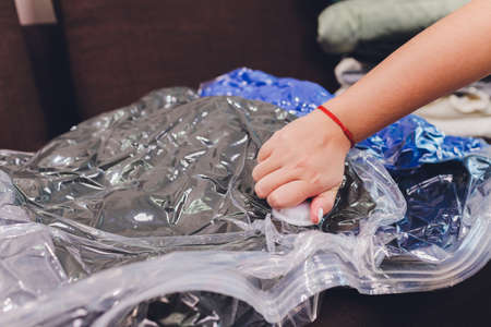 Space saver saving seal bag sucking air out , vacuum clothing storage compressed package.の写真素材