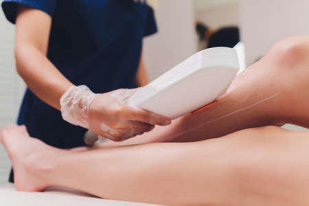 Laser hair removal on ladies legs. Intentional shallow depth of field.