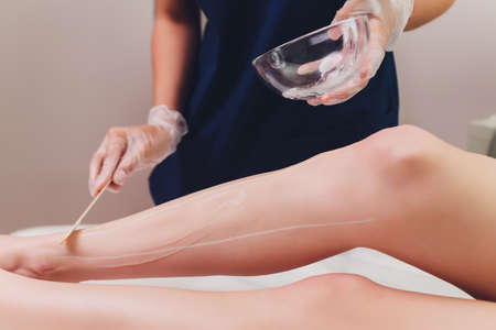 Beautician Giving Epilation Laser Treatment To Woman On Thigh.の写真素材