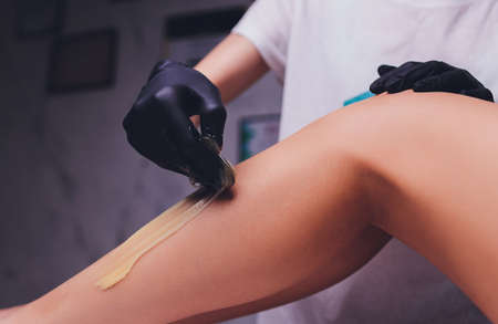 Sugaring: epilation with liquate sugar at legs.の写真素材