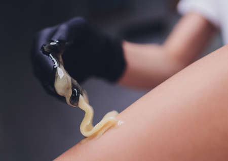 Sugaring: epilation with liquate sugar at legs.の写真素材