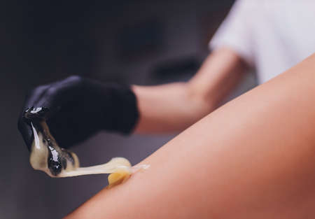 Sugaring: epilation with liquate sugar at legs.の写真素材