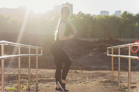 Young athletic wooman doing exercises with an elastic band. Fitness. Sport.の写真素材